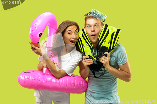 Image of Beautiful couple isolated on green studio background