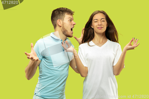 Image of Beautiful couple isolated on green studio background