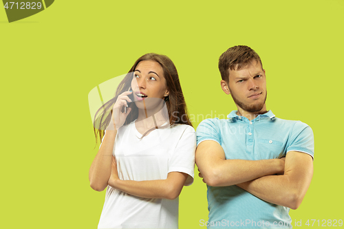 Image of Beautiful couple isolated on green studio background