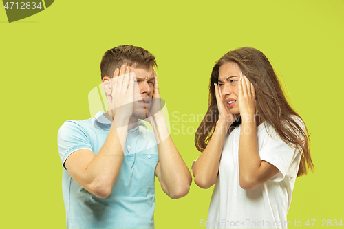 Image of Beautiful couple isolated on green studio background