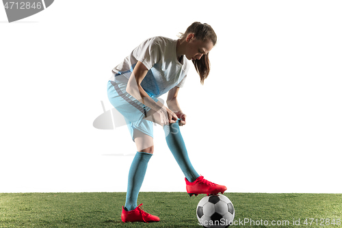 Image of Female soccer player preparing for the game isolated over white background