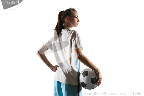 Image of Female soccer player standing with the ball isolated over white background