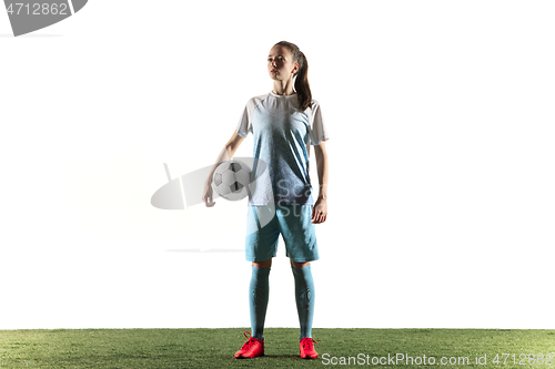 Image of Female soccer player standing with the ball isolated over white background