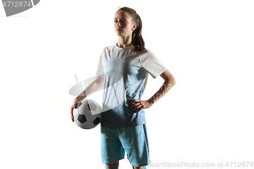 Image of Female soccer player standing with the ball isolated over white background