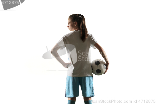 Image of Female soccer player standing with the ball isolated over white background