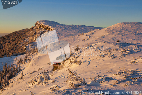 Image of Winter sunrise landscape, colored snow