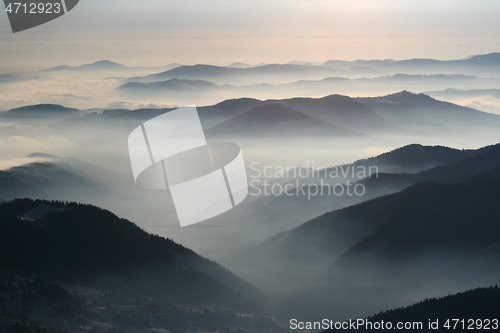 Image of Mountains and mountains, crest and low clouds