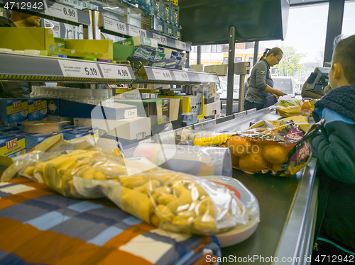 Image of Cash desk and products on conveyor belt