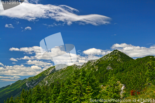 Image of Summer mountain crest and blue sky