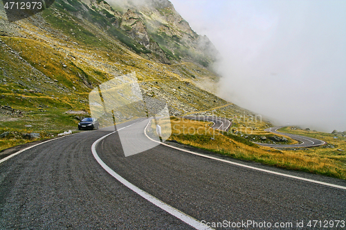 Image of Curvy mountain road in a rainy day