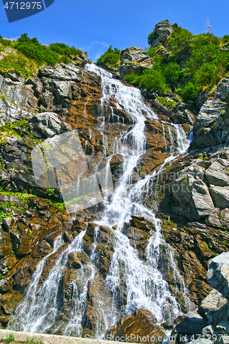 Image of Summer waterfall in a rocky mountain