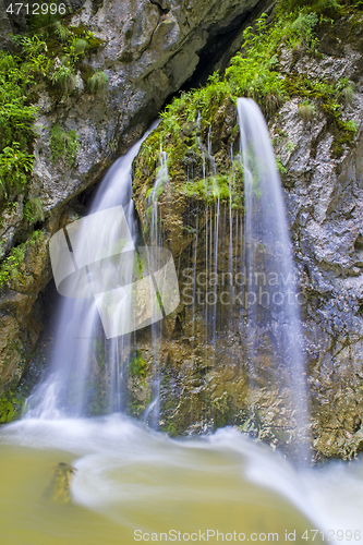 Image of Mountain waterfall in a rocky mountain