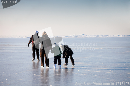 Image of Family ice skating