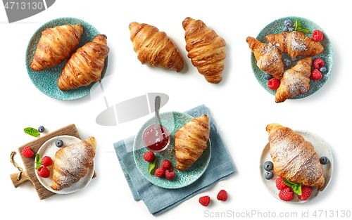 Image of freshly baked croissant on blue plate