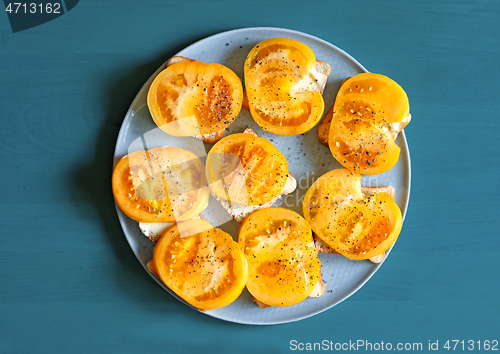 Image of plate of sandwiches with yellow tomato