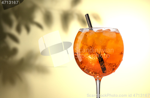 Image of glass of orange cocktail