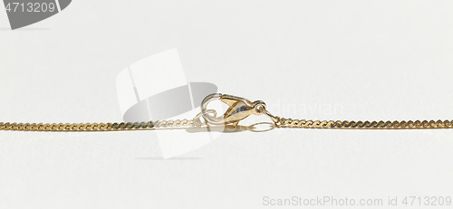 Image of gold chain on white background