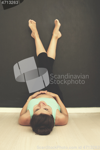 Image of pregnant women laying on the floor