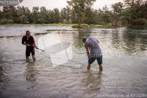 Image of young men having fun with water guns