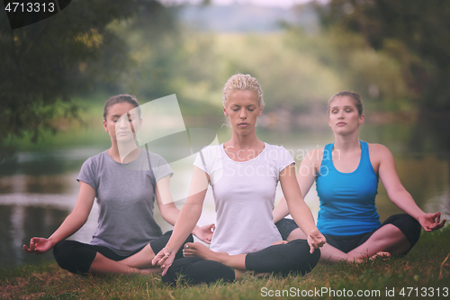 Image of women meditating and doing yoga exercise