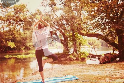 Image of woman meditating and doing yoga exercise