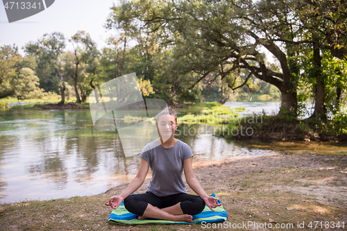 Image of woman meditating and doing yoga exercise