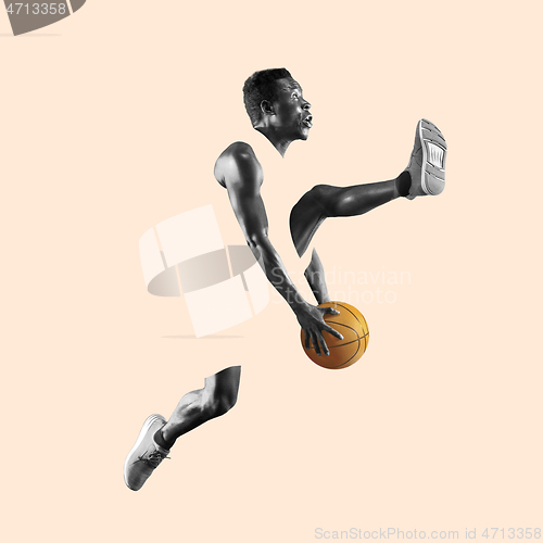 Image of Full length portrait of a basketball player with ball