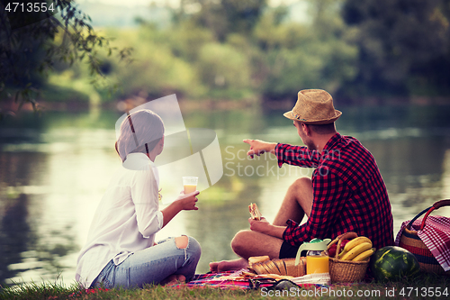 Image of Couple in love enjoying picnic time