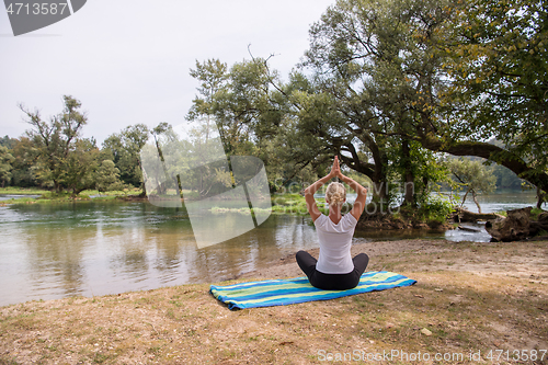 Image of woman meditating and doing yoga exercise