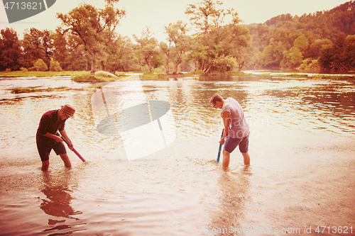 Image of young men having fun with water guns