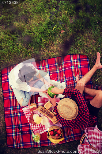 Image of top view of couple enjoying picnic time
