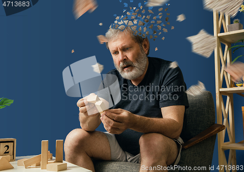 Image of Old bearded man with alzheimer desease