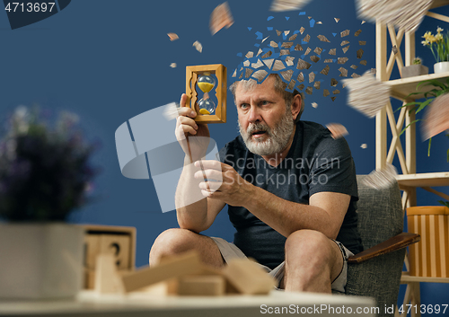 Image of Old bearded man with alzheimer desease