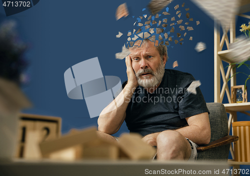 Image of Old bearded man with alzheimer desease