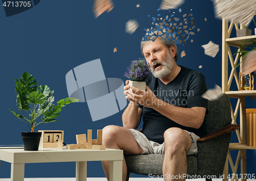 Image of Old bearded man with alzheimer desease