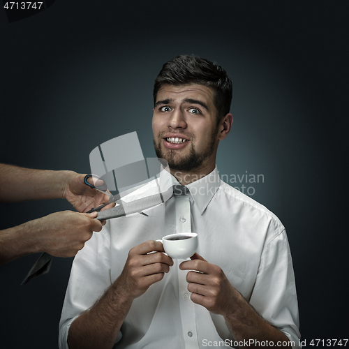 Image of A young man surrounded by hands like his own thoughts