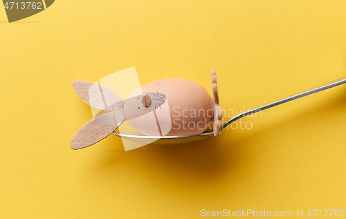 Image of bunny shaped easter egg in a spoon