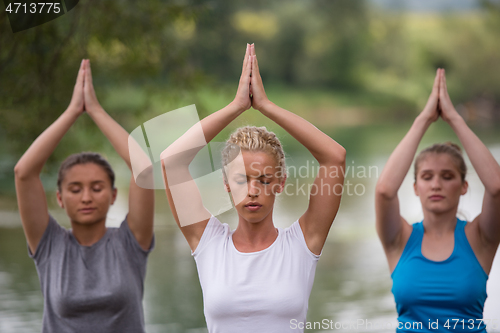 Image of women meditating and doing yoga exercise