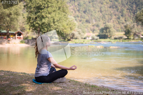 Image of woman meditating and doing yoga exercise