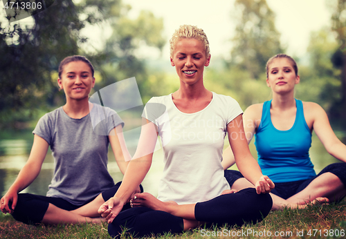 Image of women meditating and doing yoga exercise