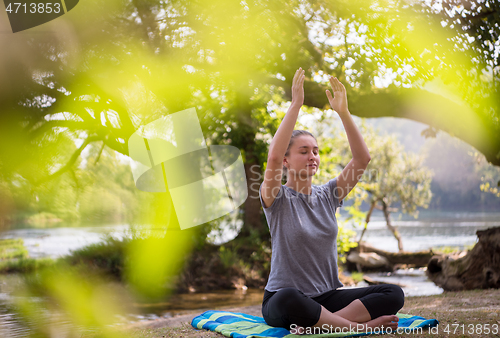 Image of woman meditating and doing yoga exercise