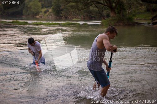 Image of young men having fun with water guns