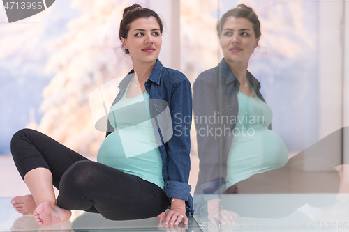 Image of pregnant women sitting on the floor