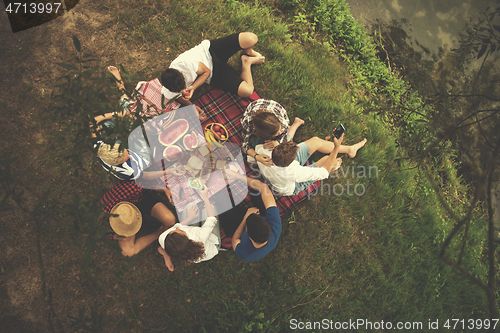 Image of top view of group friends enjoying picnic time