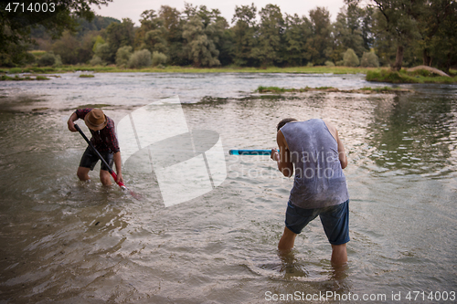 Image of young men having fun with water guns