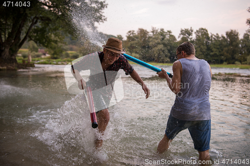 Image of young men having fun with water guns