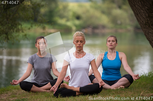 Image of women meditating and doing yoga exercise