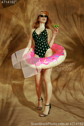 Image of Beautiful girl isolated on braun studio background