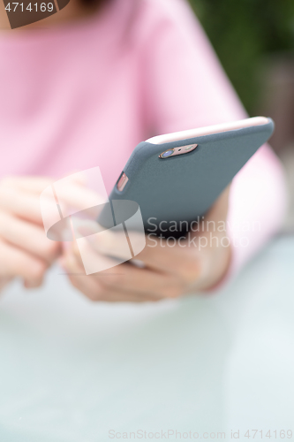 Image of Woman touch of cellphone