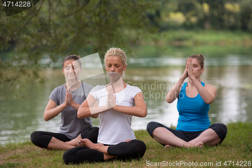 Image of women meditating and doing yoga exercise